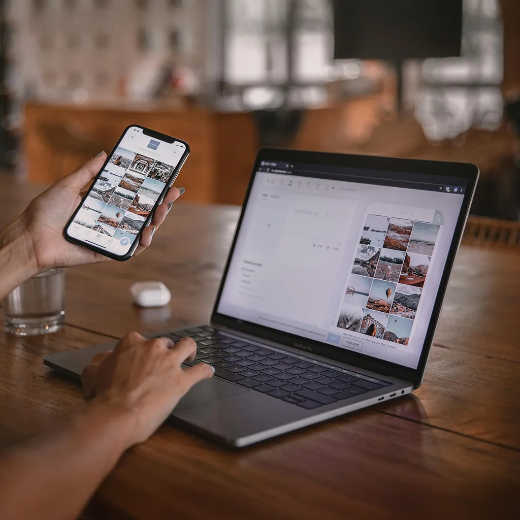 Social media management dashboard on a laptop and smartphone.